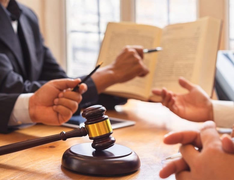 Lawyers going over documents in the Carton Law Office in Shrewsbury, NY